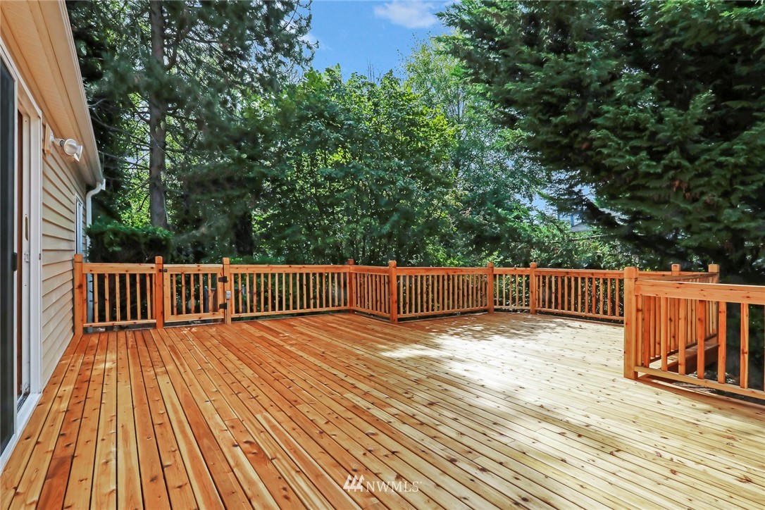 930 243rd Street Southwest Bothell, WA 98021 - Photo 35 of 37 a view of balcony with wooden floor and fence