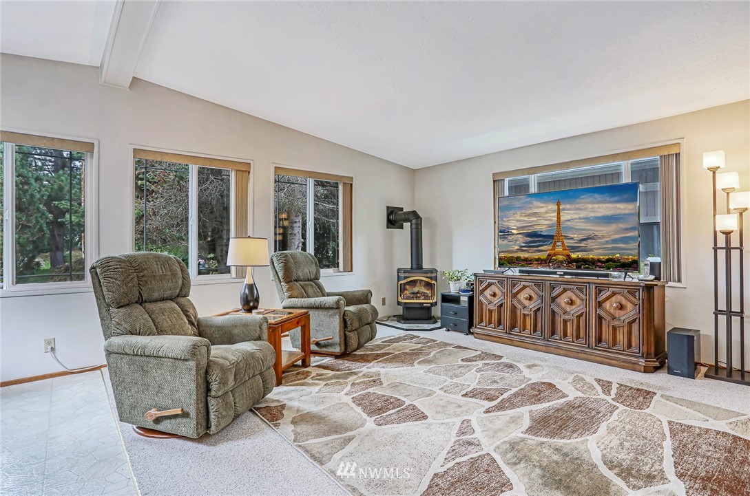 930 243rd Street Southwest Bothell, WA 98021 - Photo 6 of 37 a living room with furniture and a flat screen tv