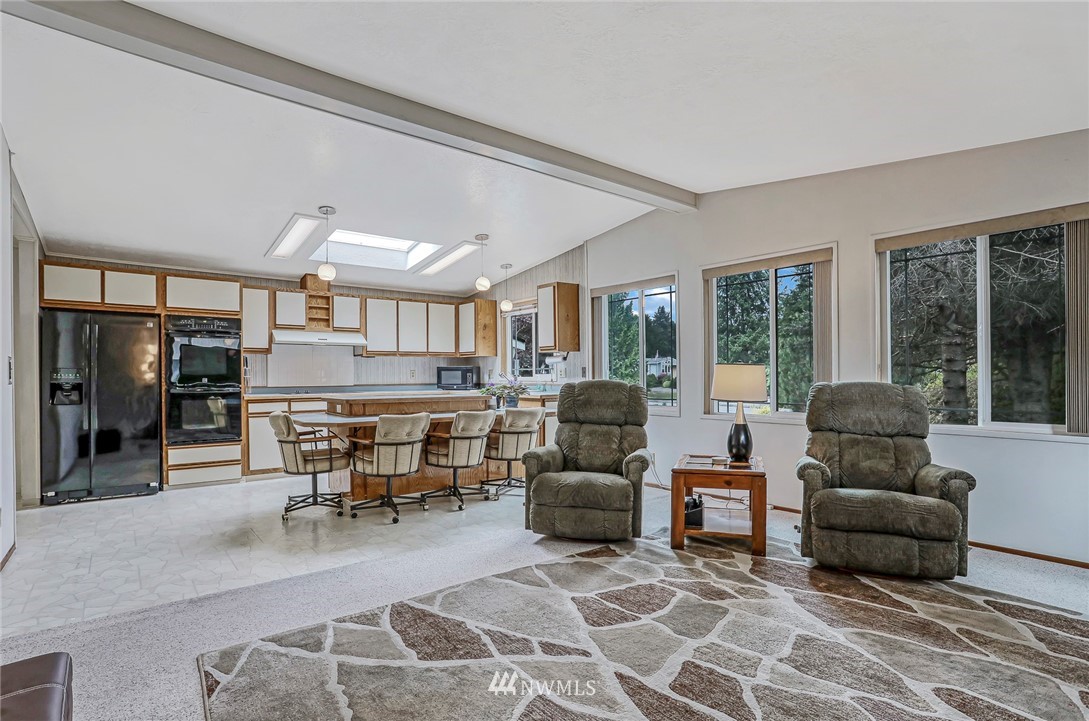 930 243rd Street Southwest Bothell, WA 98021 - Photo 7 of 37 a living room with furniture and a table
