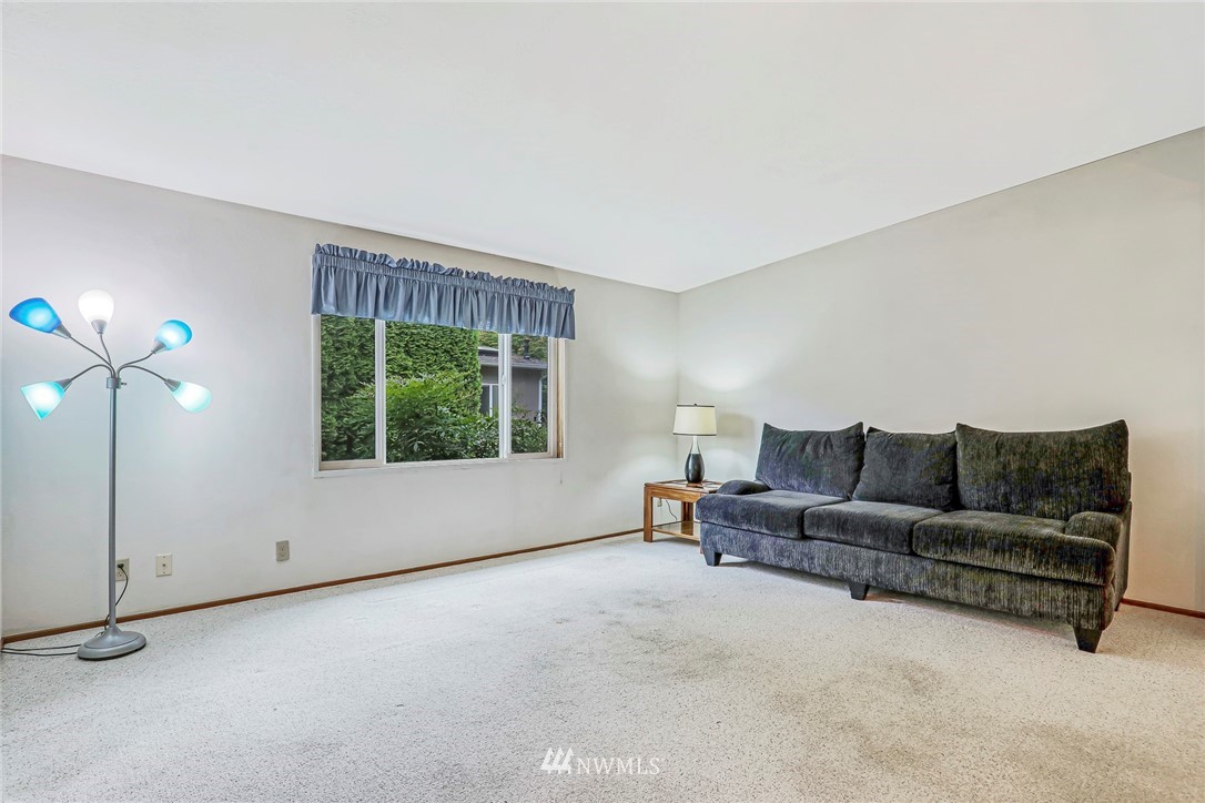 930 243rd Street Southwest Bothell, WA 98021 - Photo 10 of 37 a living room with furniture and a large window