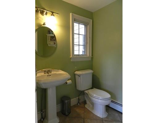 10 Mercer Road Needham, MA 02494 - Photo 14 of 22 a bathroom with a toilet sink and mirror