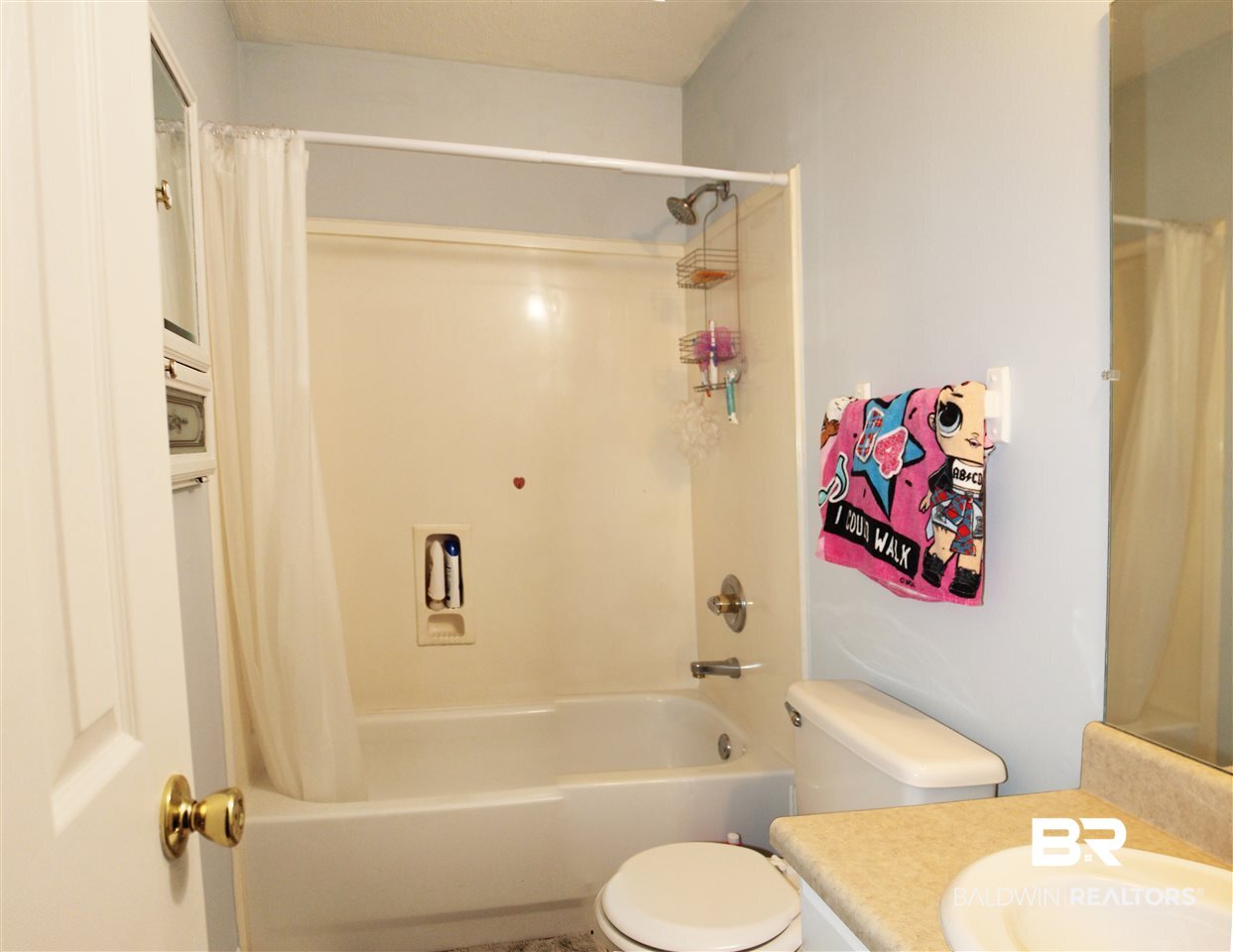 4587 Emerald Drive East Mobile, AL 36619 - Photo 11 of 16 The hall bath is convenient to the bedrooms.