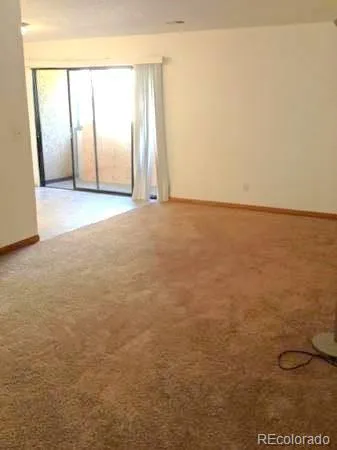 a view of an empty room and window