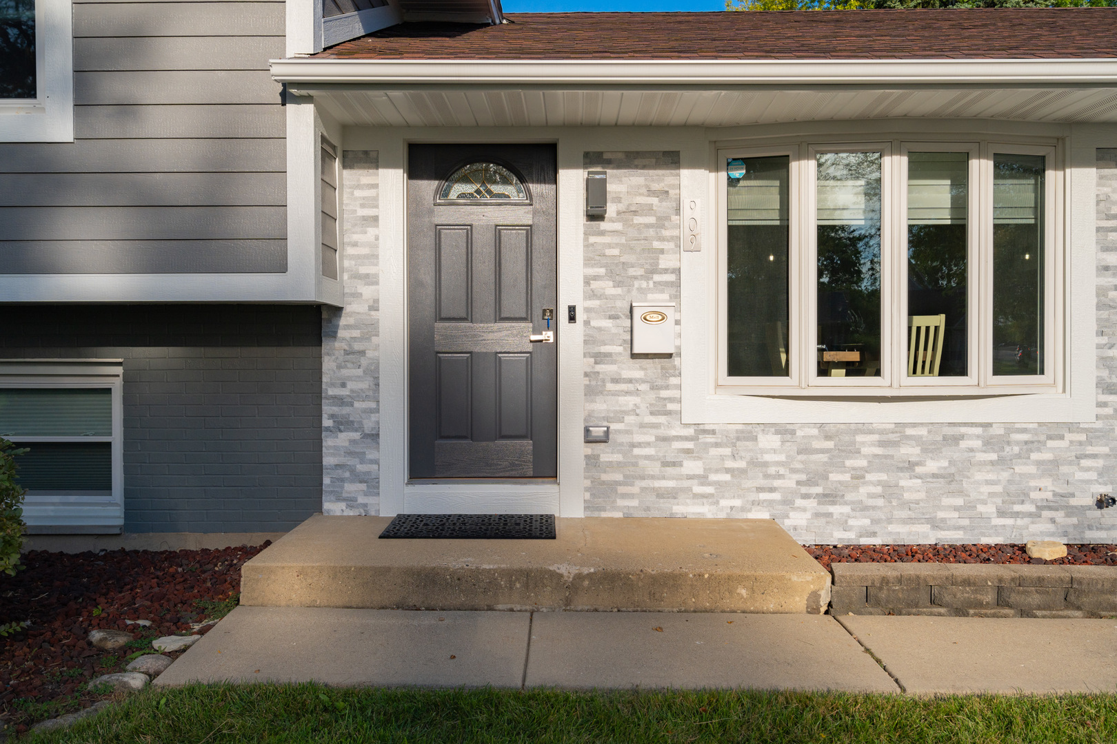 909 Springfield Drive Roselle, IL 60172 - Photo 2 of 42 a front view of a house with a garage