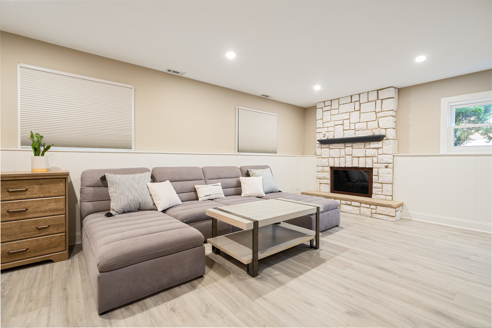 909 Springfield Drive Roselle, IL 60172 - Photo 22 of 42 a living room with furniture a large window and a fireplace