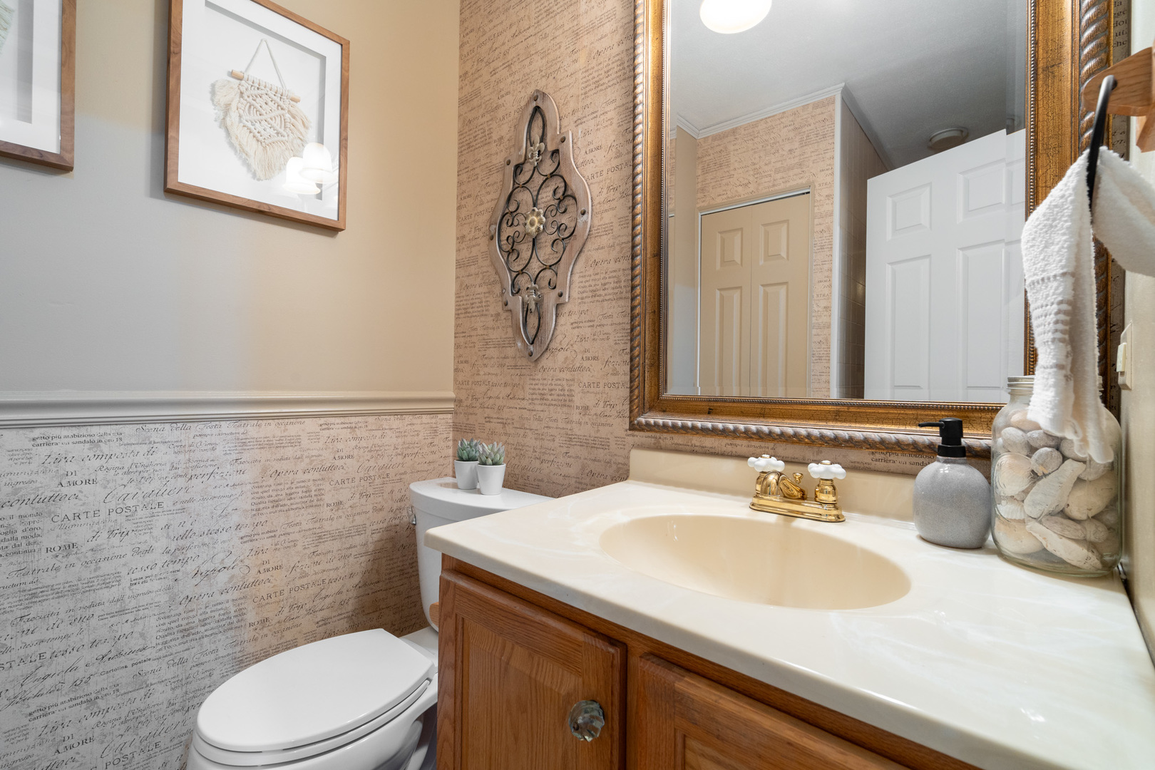 909 Springfield Drive Roselle, IL 60172 - Photo 28 of 42 a bathroom with a granite countertop toilet sink and mirror
