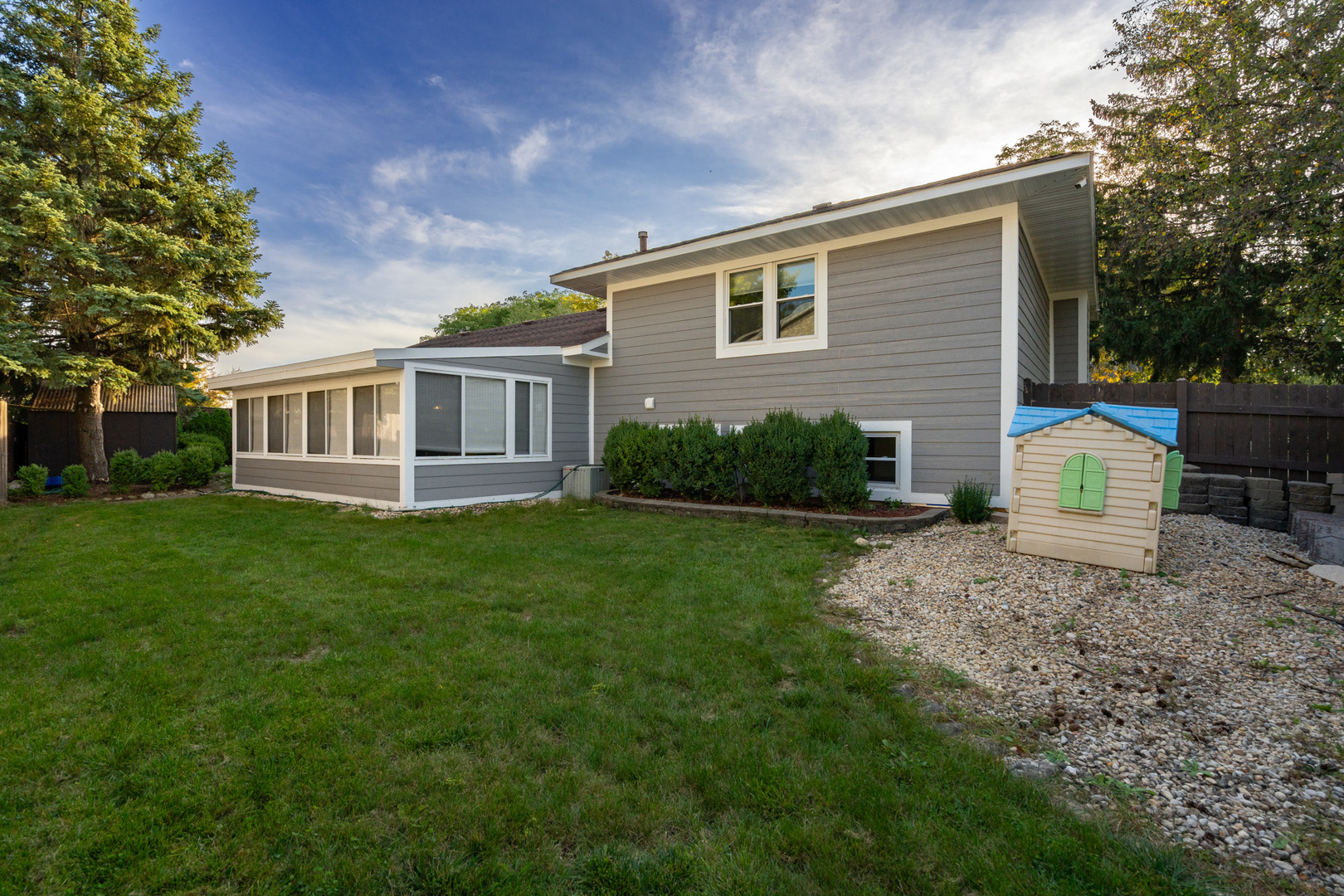 909 Springfield Drive Roselle, IL 60172 - Photo 40 of 42 a view of a house with a backyard