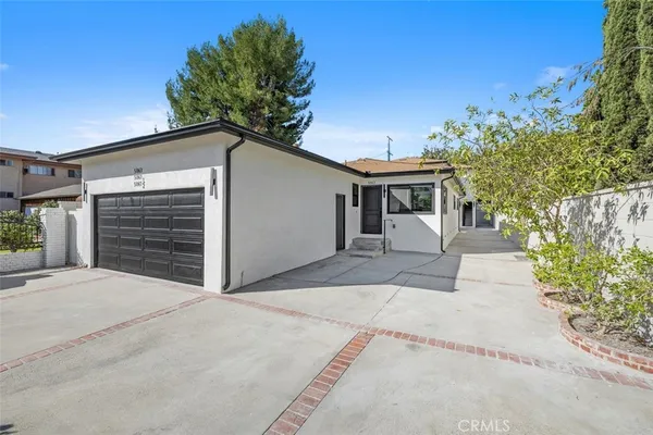 a front view of a house with a garage