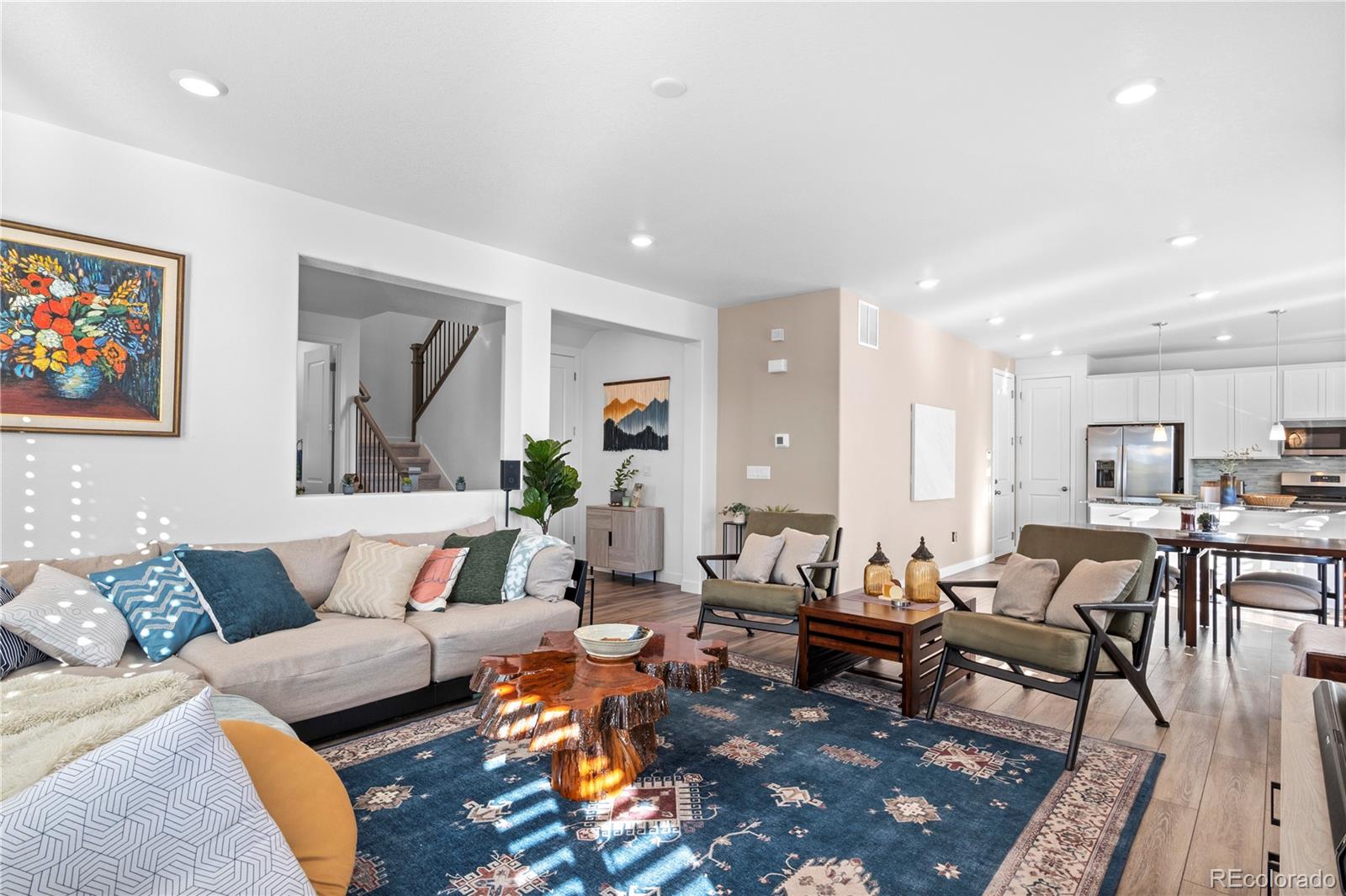 a living room with furniture and a rug