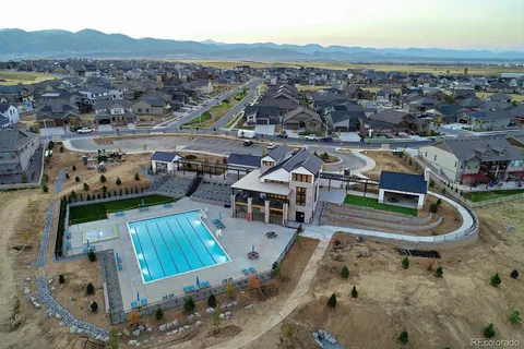 an aerial view of a house with a swimming pool