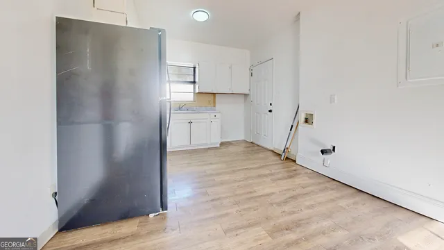a view of a kitchen from the hallway