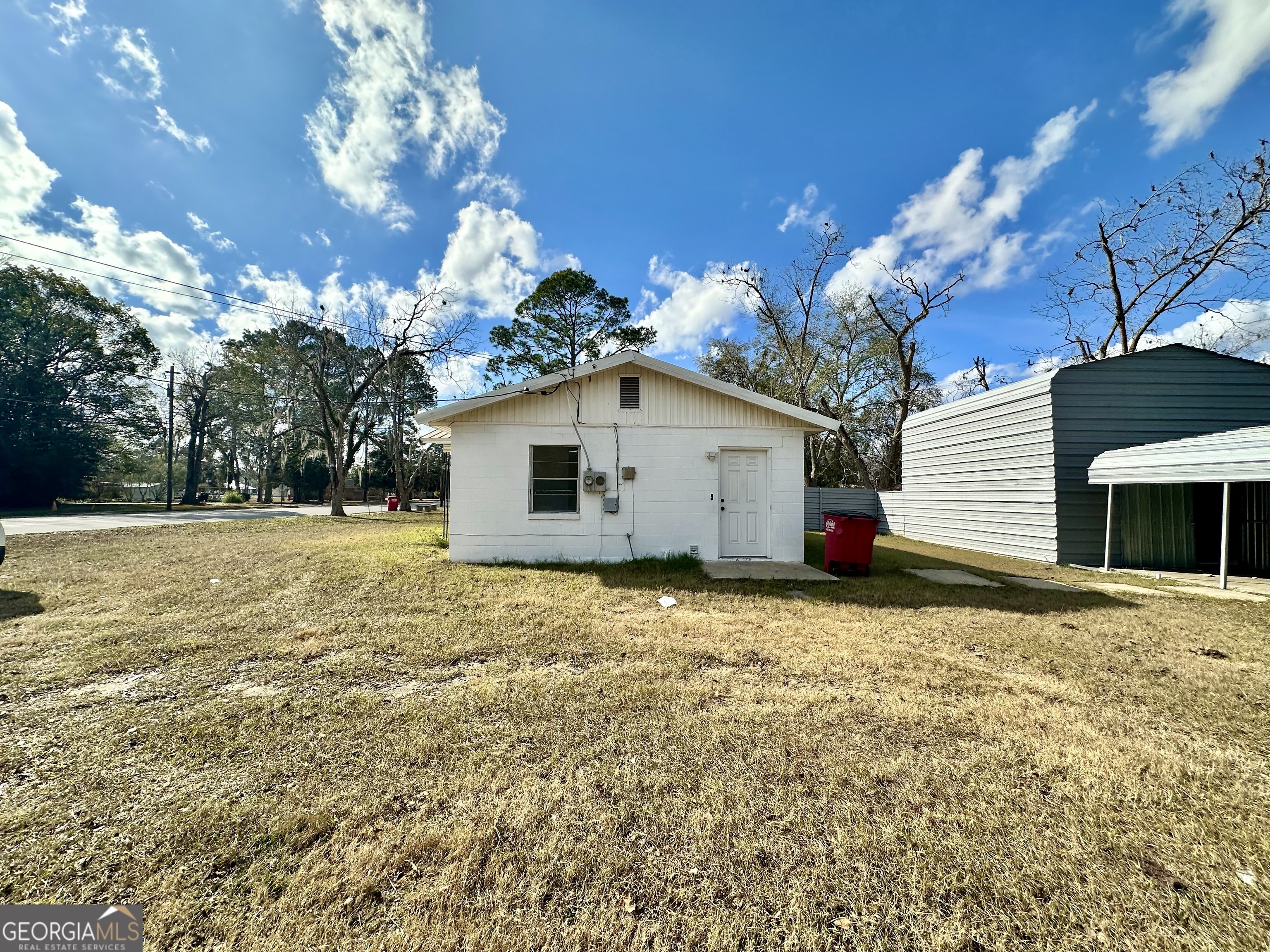 526 Ware Street Blackshear, GA 31516 - Photo 19 of 26 a view of a house with a yard