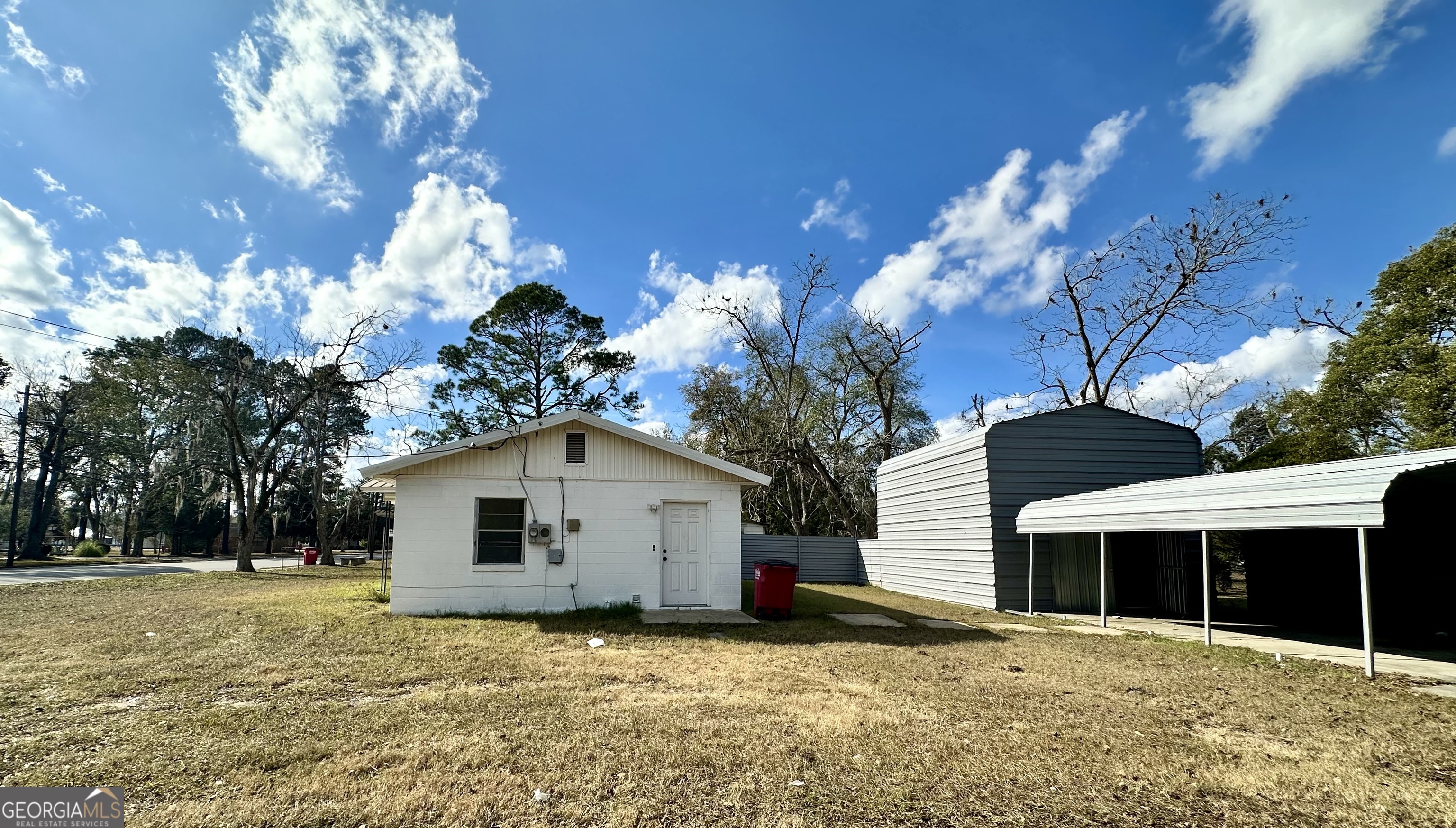 526 Ware Street Blackshear, GA 31516 - Photo 20 of 26 a view of a house with a yard
