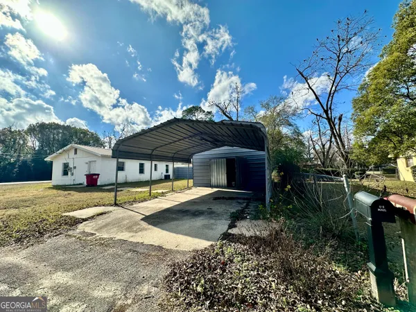 a house view with a backyard space
