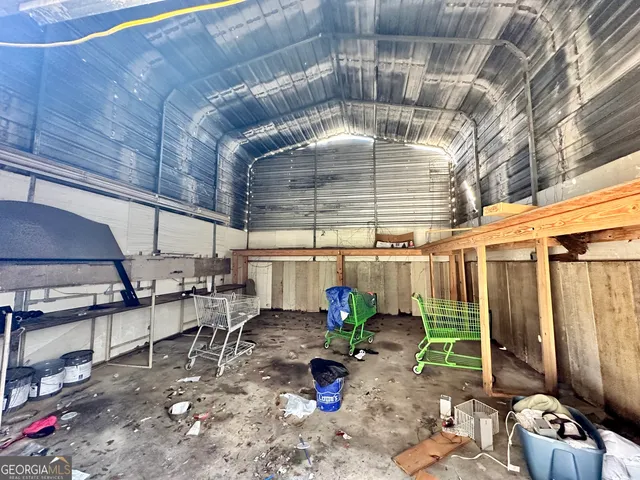 a room with lots of potted plants