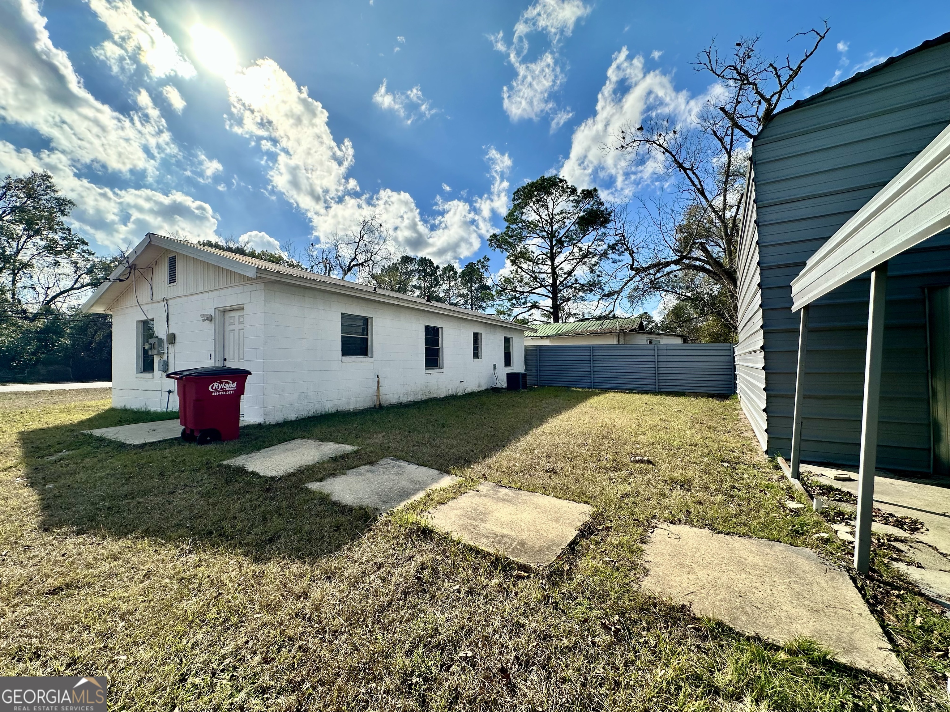526 Ware Street Blackshear, GA 31516 - Photo 24 of 26 a view of a house with a backyard
