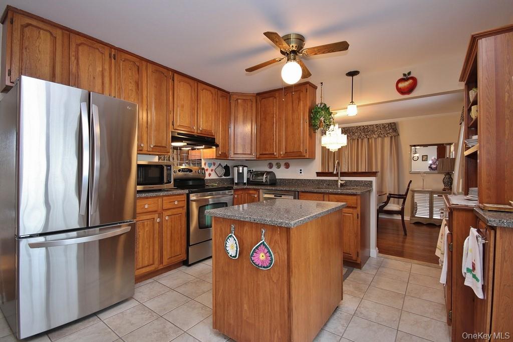2597 Quaker Church Road Yorktown Heights, NY 10598 - Photo 2 of 37 a kitchen with stainless steel appliances granite countertop a refrigerator a sink and dishwasher