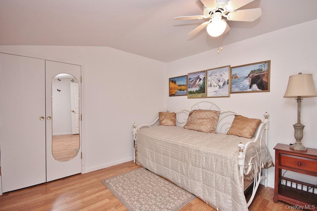 2597 Quaker Church Road Yorktown Heights, NY 10598 - Photo 21 of 37 a bedroom with a bed and wooden floor