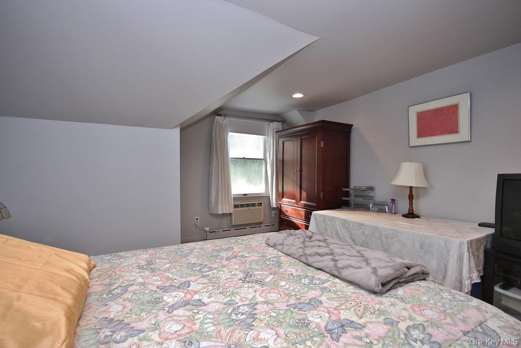 2597 Quaker Church Road Yorktown Heights, NY 10598 - Photo 27 of 37 a bedroom with a large bed and a window