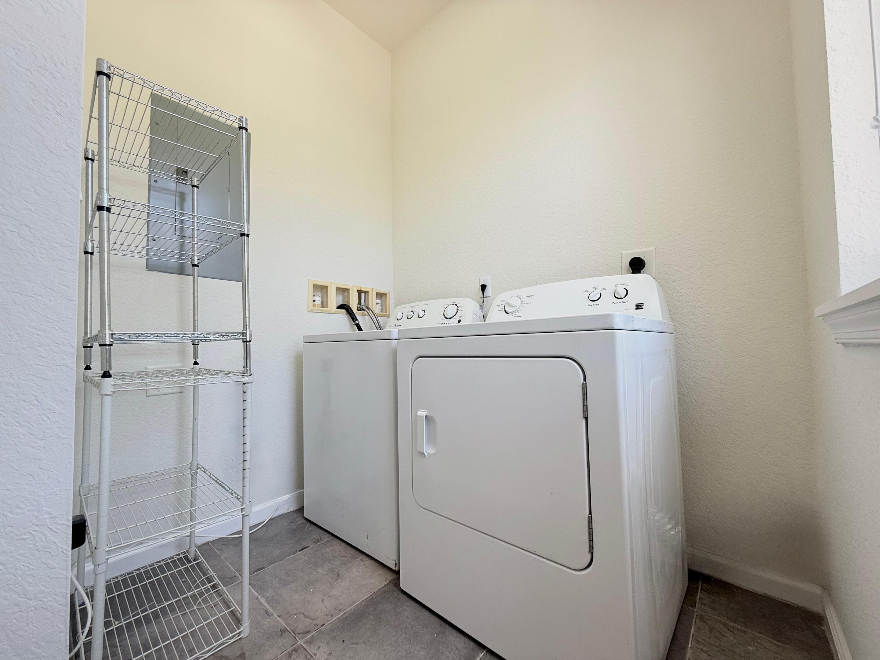 425 Greenwich Circle, Unit 206 Jupiter, FL 33458 - Photo 13 of 30 a utility room with dryer and washer