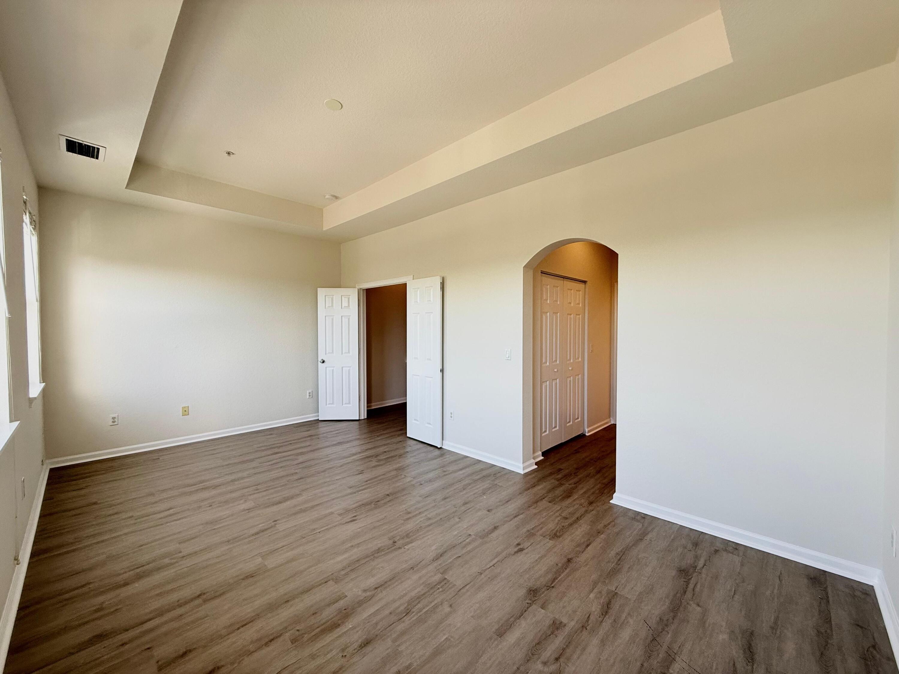 425 Greenwich Circle, Unit 206 Jupiter, FL 33458 - Photo 19 of 30 a view of an empty room with wooden floor