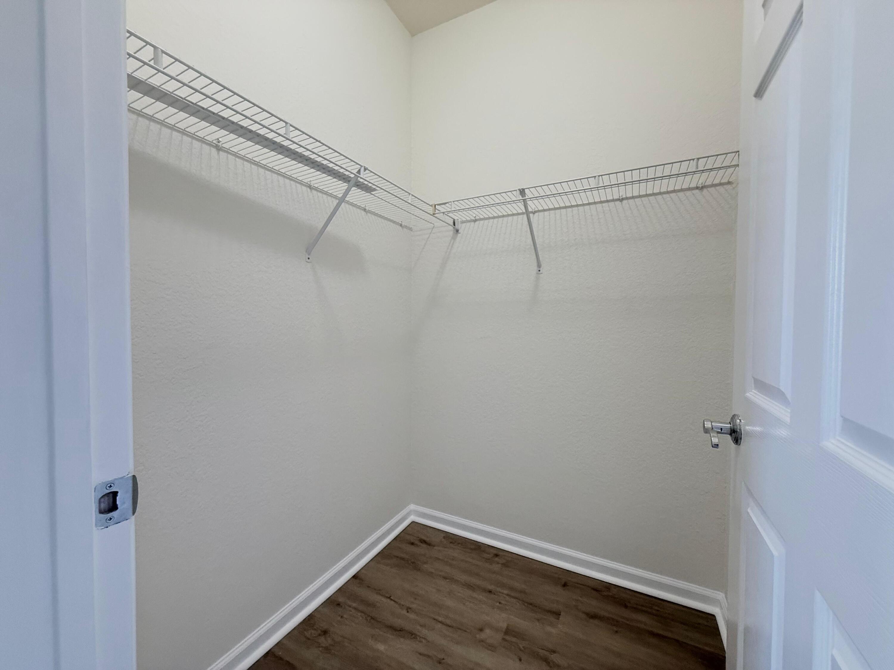425 Greenwich Circle, Unit 206 Jupiter, FL 33458 - Photo 27 of 30 a view of a room with racks on the wall