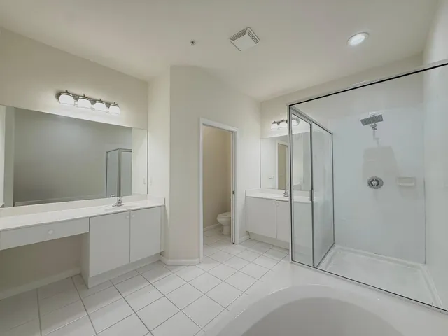 a bathroom with a shower and a sink