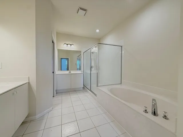 a bathroom with a bathtub and a sink