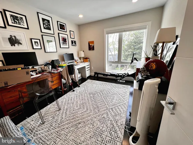 a bedroom with furniture and a window