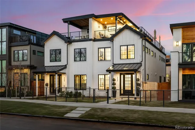 a front view of a residential apartment building with a yard