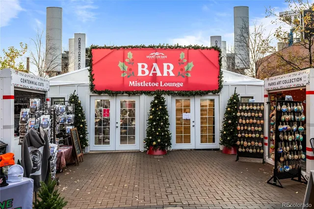 a view of a street with shops