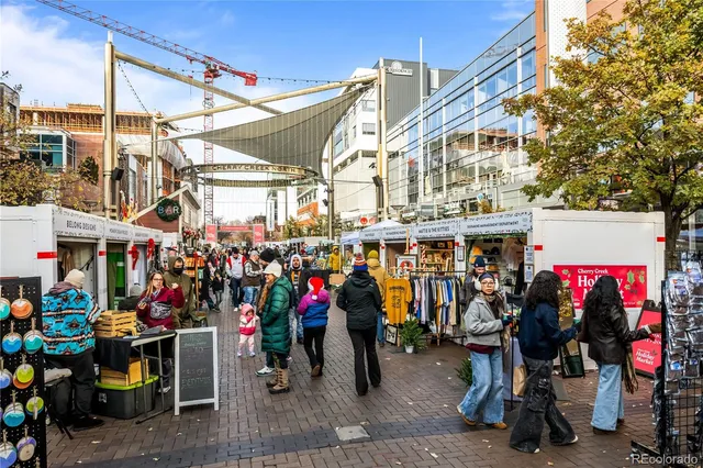 a view of street with wooden wall