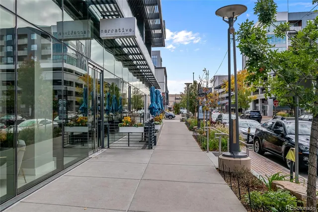 a view of path along with retail shop and buildings