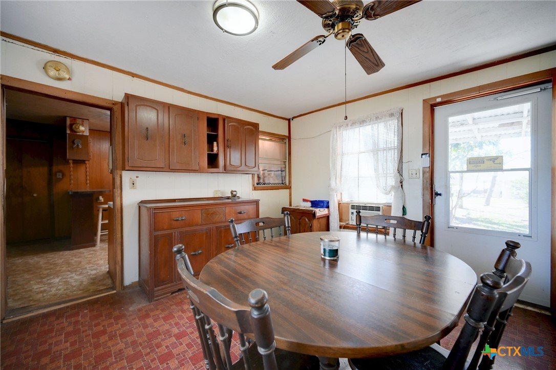 1631 East Fannin Street Luling, TX 78648 - Photo 15 of 27 a view of a dining room with furniture window and outside view