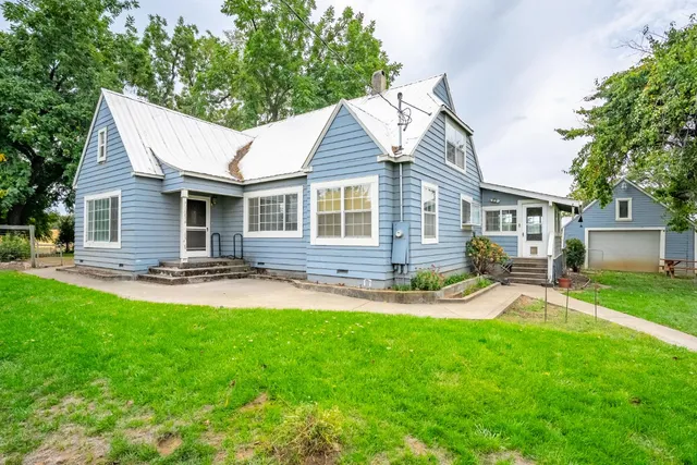 a view of a house with a outdoor space and porch