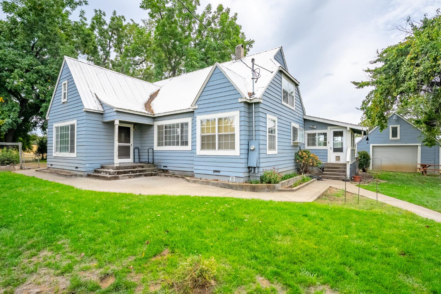 6340 Grizzly Flat Road Somerset, CA 95684 - Photo 12 of 92 a backyard of a house with table and chairs
