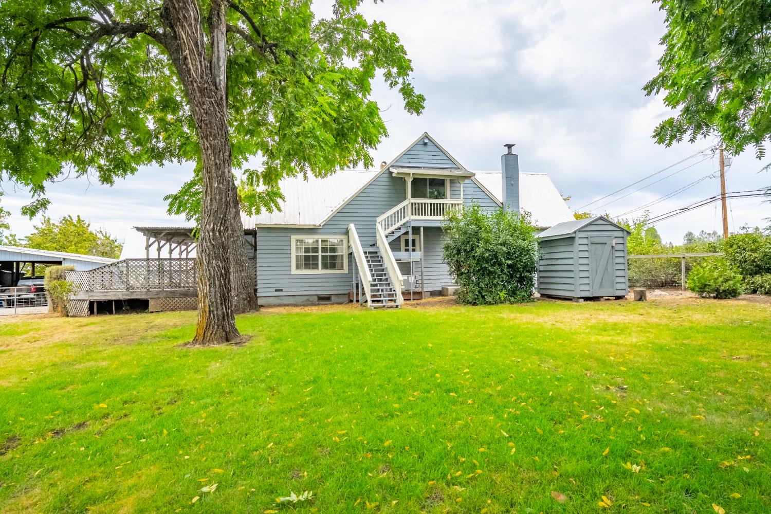 6340 Grizzly Flat Road Somerset, CA 95684 - Photo 17 of 92 a front view of a house with a yard and trees