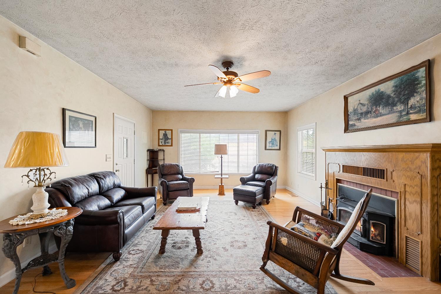 6340 Grizzly Flat Road Somerset, CA 95684 - Photo 26 of 92 a living room with furniture a fireplace and a window