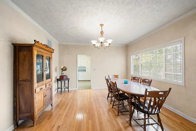 a bedroom with a balcony a bed and a mirror