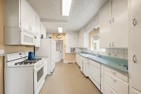 a front view of a house with outdoor seating