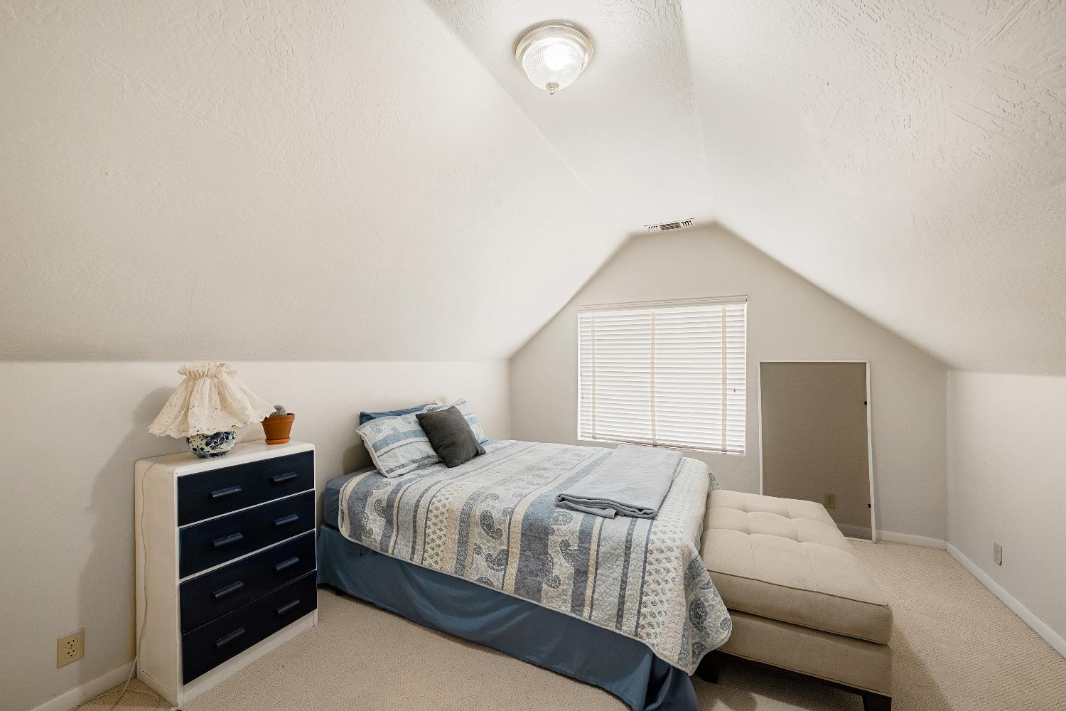 6340 Grizzly Flat Road Somerset, CA 95684 - Photo 49 of 92 a bedroom with a bed and a window