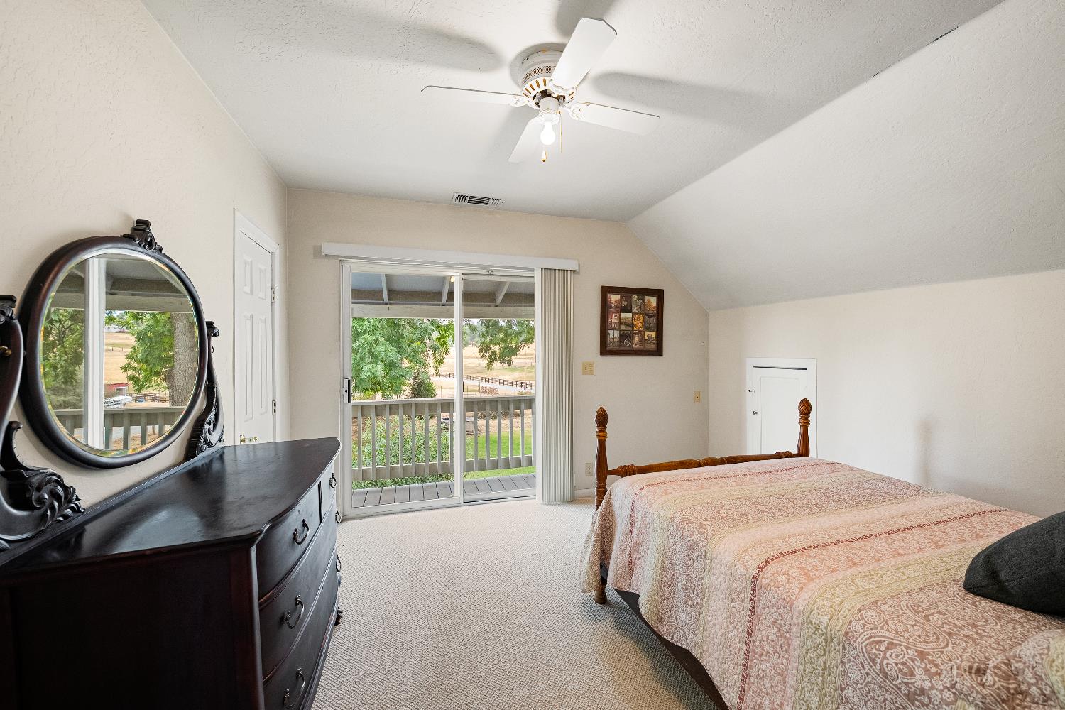 6340 Grizzly Flat Road Somerset, CA 95684 - Photo 50 of 92 a bedroom with a balcony a bed and a mirror