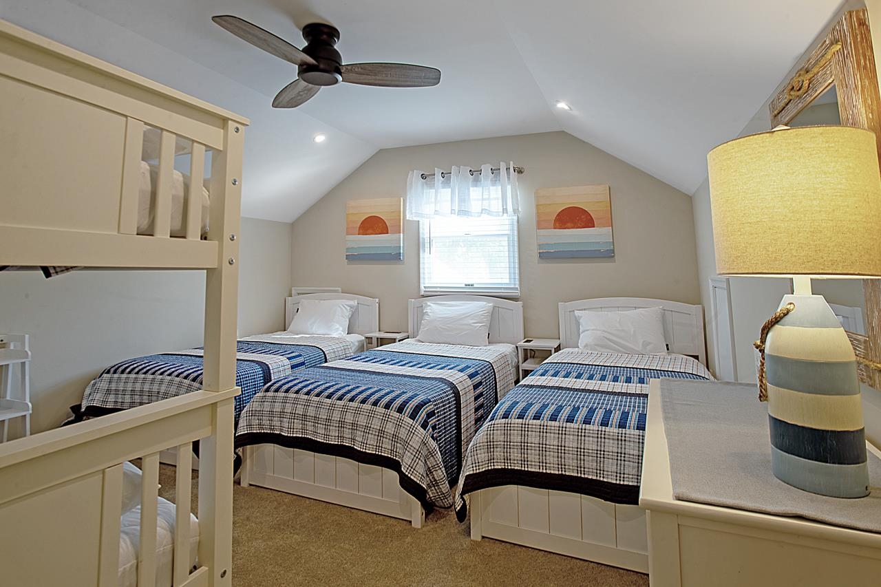1015 Shunpike Road Cape May, NJ 08204 - Photo 29 of 34 a bedroom with a bed and dresser