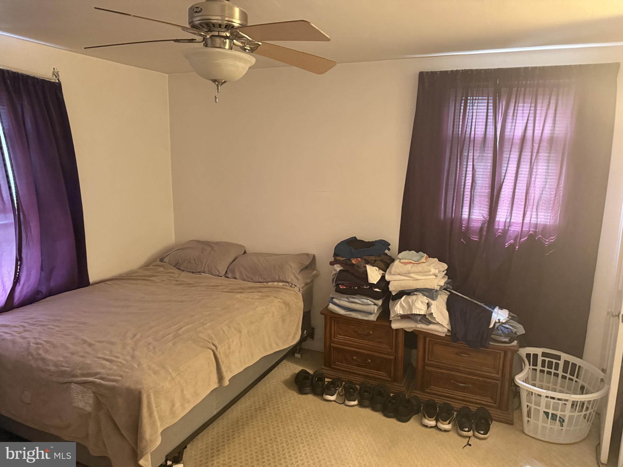 2203 Steele Road Drexel Hill, PA 19026 - Photo 2 of 14 a bedroom with a bed and window