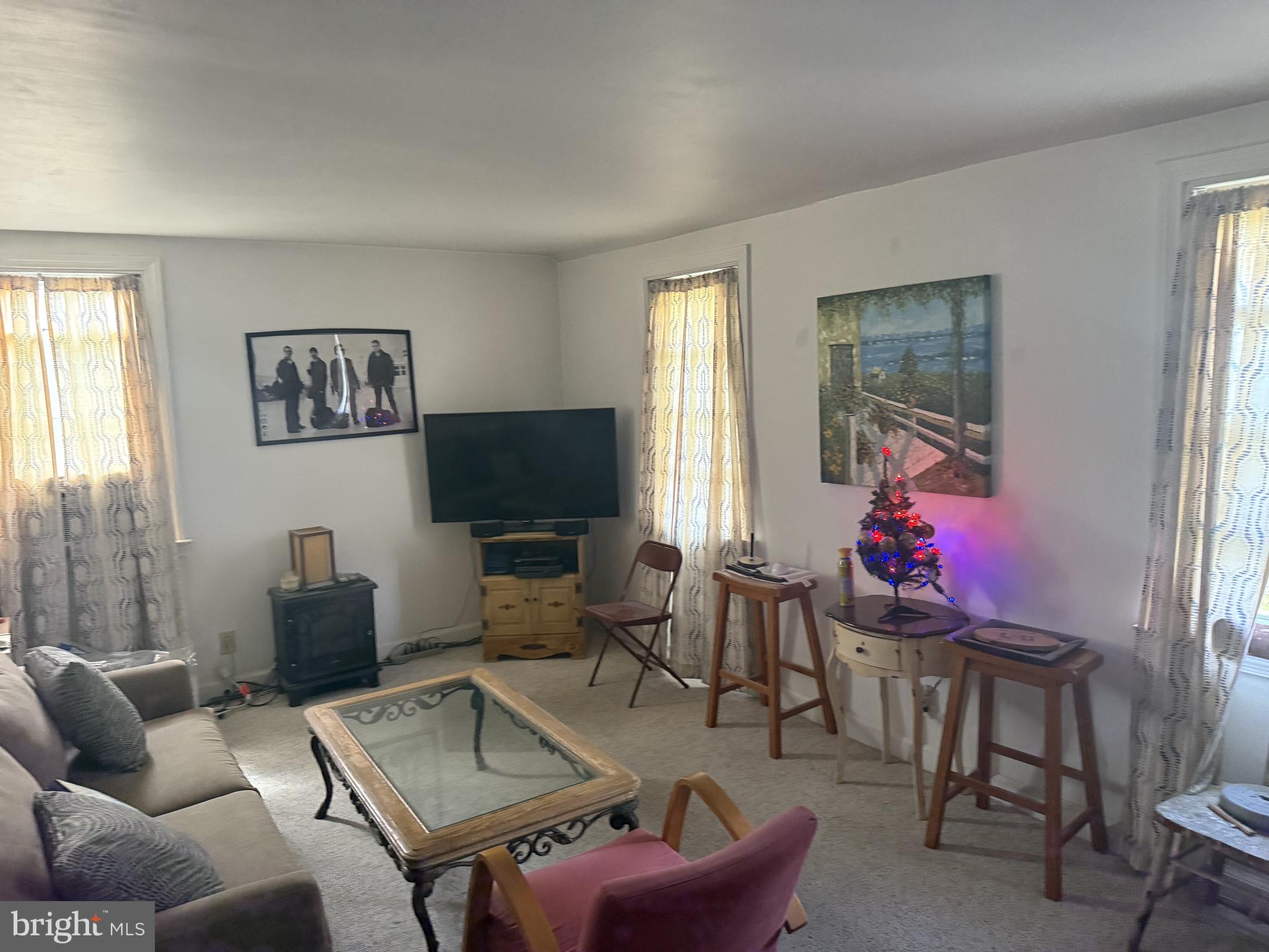 2203 Steele Road Drexel Hill, PA 19026 - Photo 3 of 14 a living room with furniture and a flat screen tv