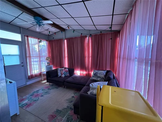 a living room with furniture and a window