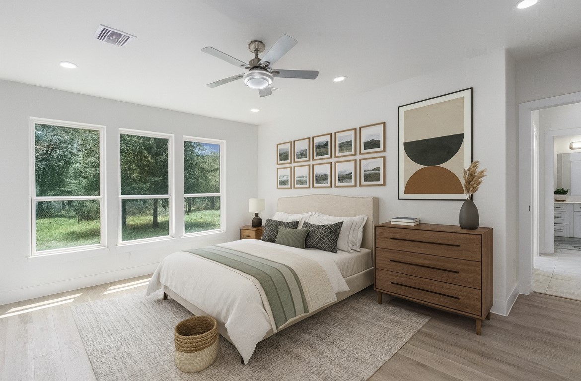 702 Azalea Street Waller, TX 77484 - Photo 20 of 45 a bedroom with a large bed and a window