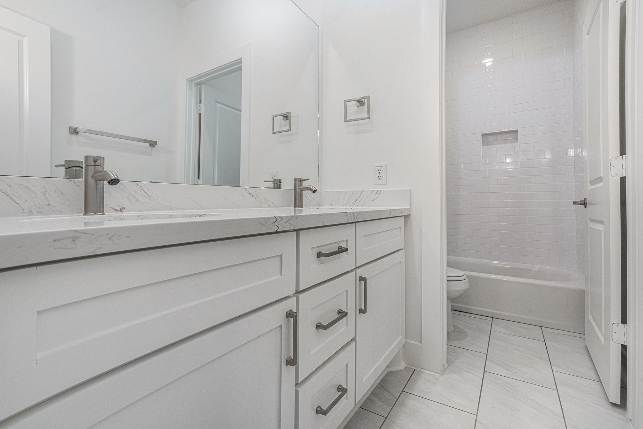 702 Azalea Street Waller, TX 77484 - Photo 36 of 45 a bathroom with a sink a toilet and shower