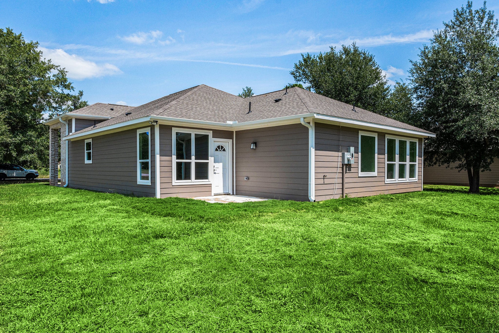 702 Azalea Street Waller, TX 77484 - Photo 41 of 45 a front view of a house with a garden