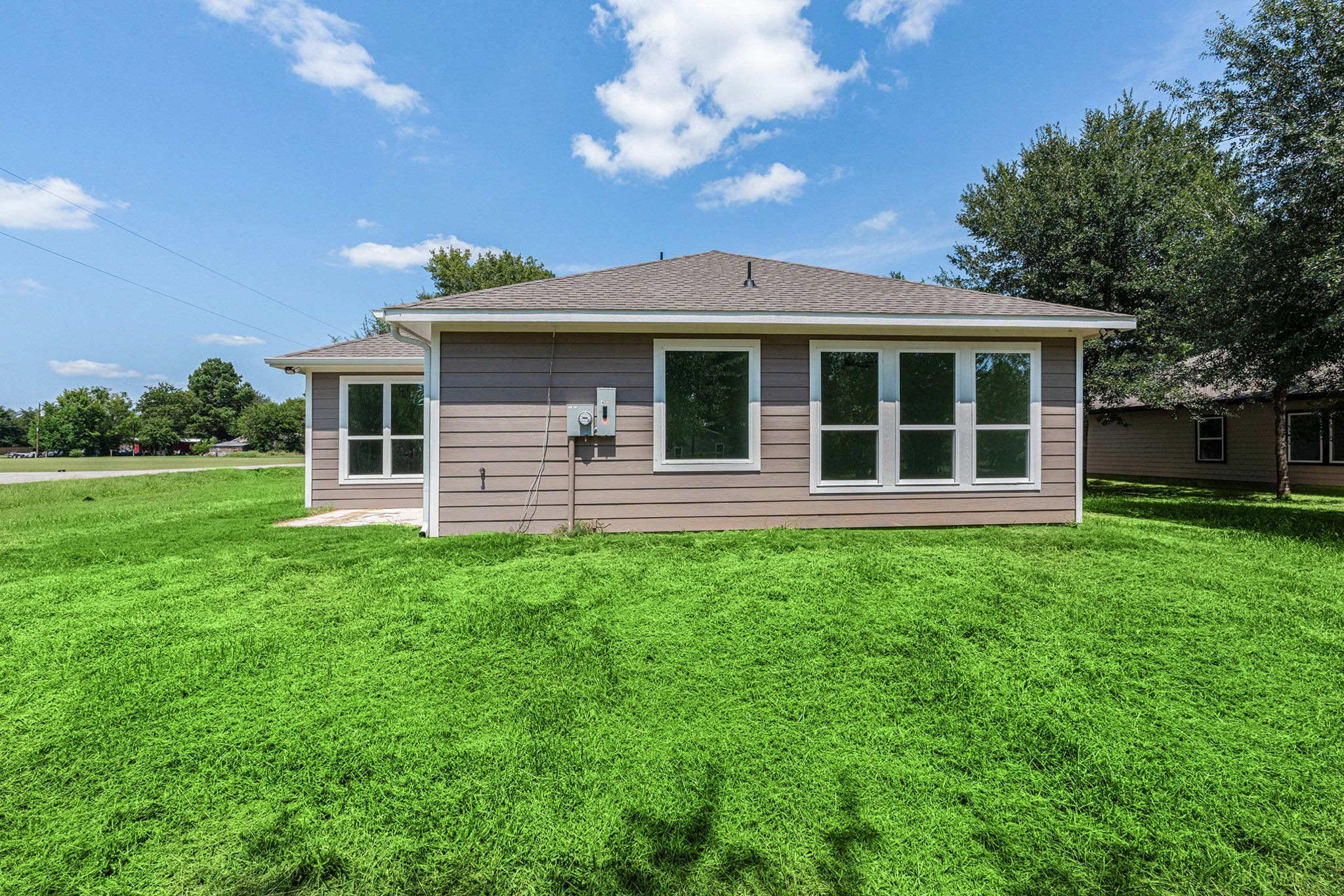 702 Azalea Street Waller, TX 77484 - Photo 43 of 45 a front view of a house with a garden